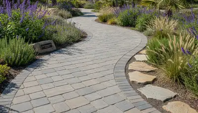 Curved stone paver pathway in Los Angeles, CA showcasing professional landscaping design and craftsmanship